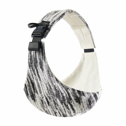 Needella CozyCarry Hüfttrage in meliertem Schwarz-Weiß Verlauf als Studioaufnahme des Produkts